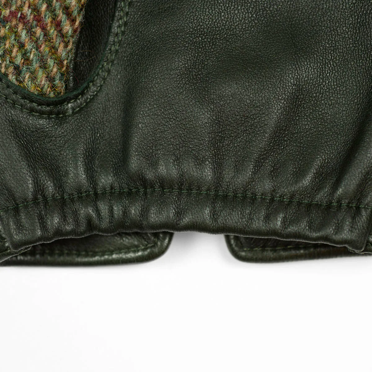 Hunter green cashmere-lined gloves with Harris Tweed herringbone back